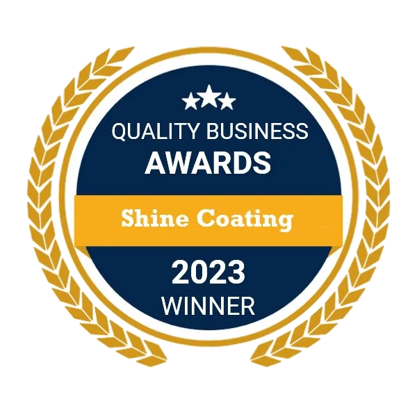 A circular badge with a gold laurel wreath border. It has a blue background with white and yellow text. Highlighting excellence in both exterior painting and interior painting.