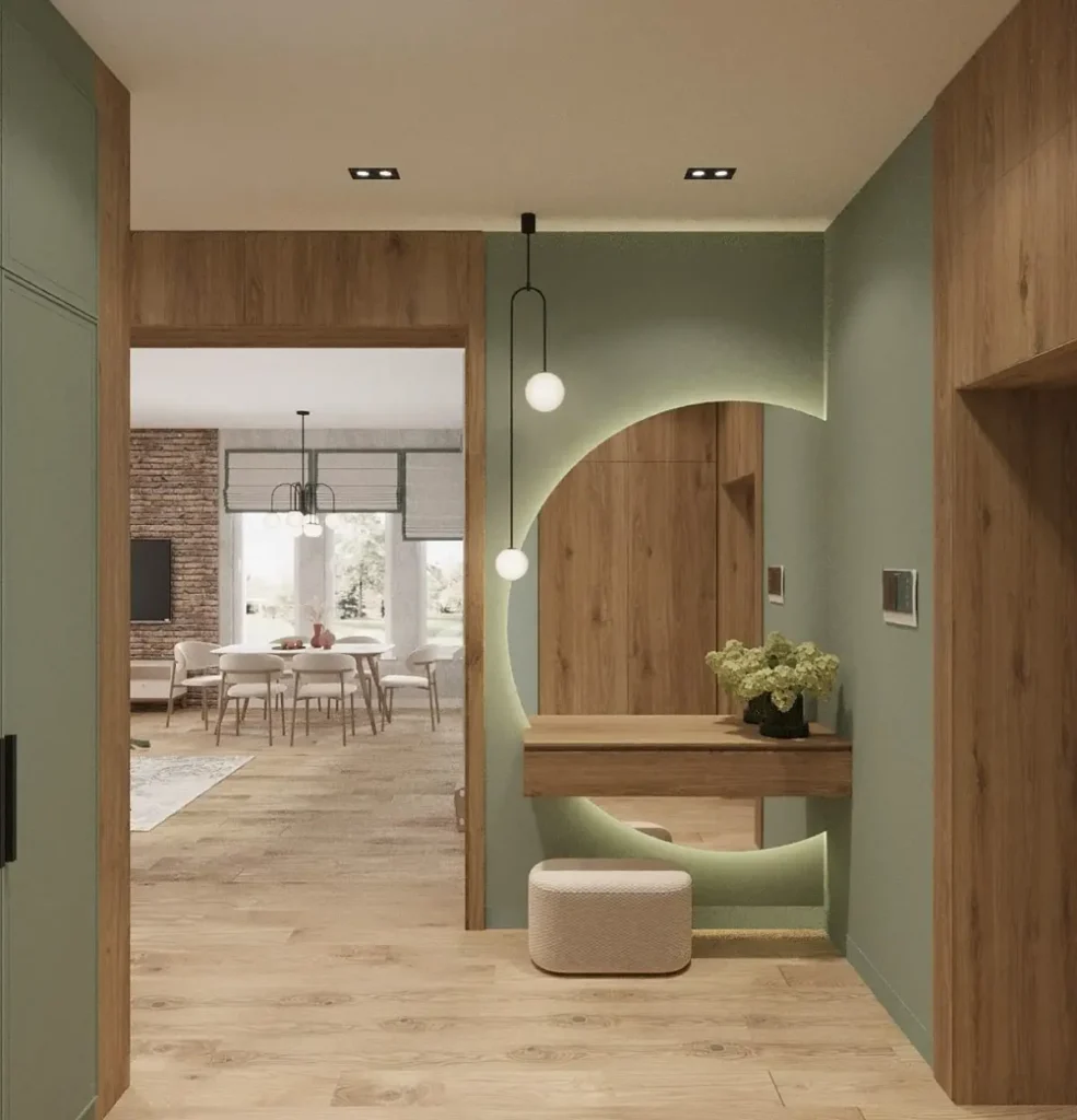 A modern living room painted in a warm greige with a plush cream sofa and natural wood coffee table, showcasing a 2025 interior paint colour trend