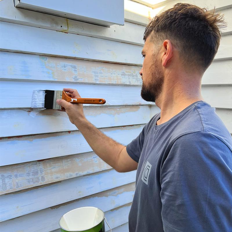 Applying exterior paint to a properly prepared timber surface